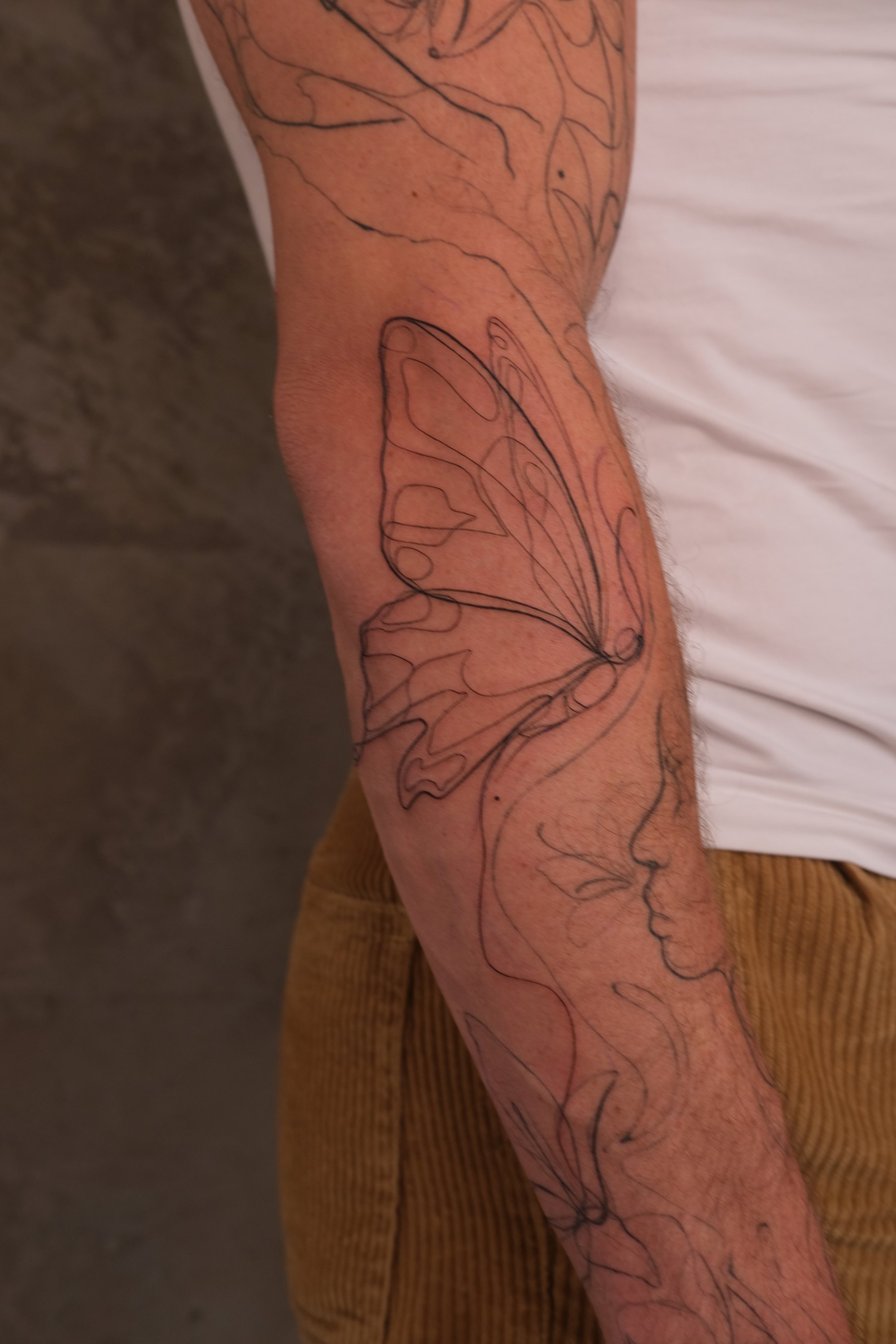 Fine line abstract tattoo by Alma Studio, Brighton