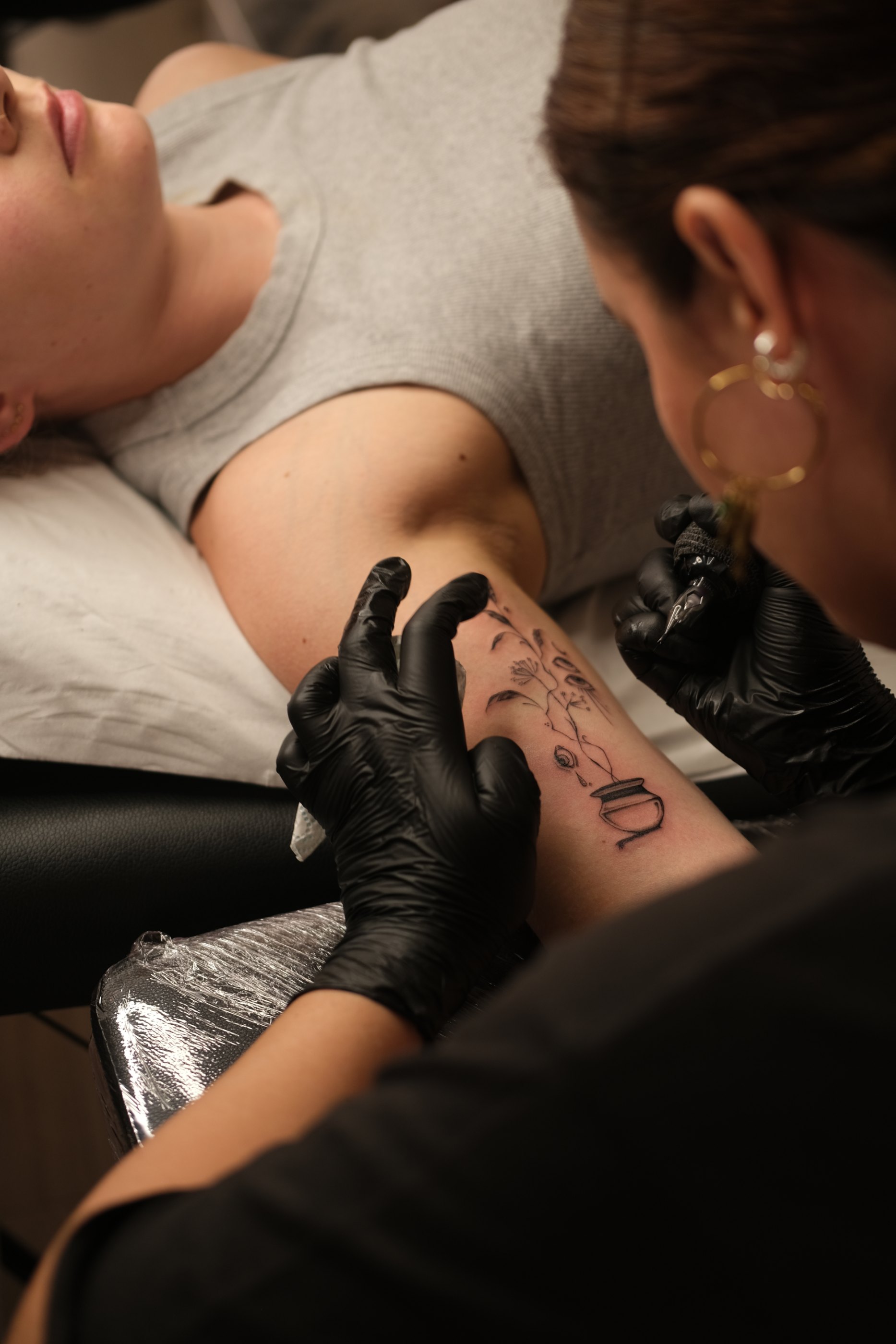 Fine line botanical tattoo by Alma Studio, Brighton