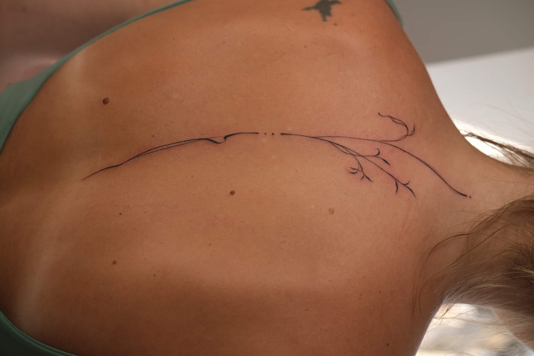 Fine line abstract tattoo by Alma Studio, Brighton